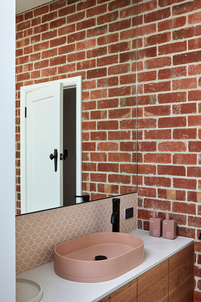 Glen Iris ensuite featuring Nood Co. Pill Basin in Blush Pink with exposed brick and blush tile splashback.